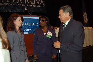 The Honorable Elizabeth A. McGrath (l), deputy chief management officer for the U.S. Defense Department, joins Shana Muhammad and Sam Jones, chapter president, at the December luncheon.